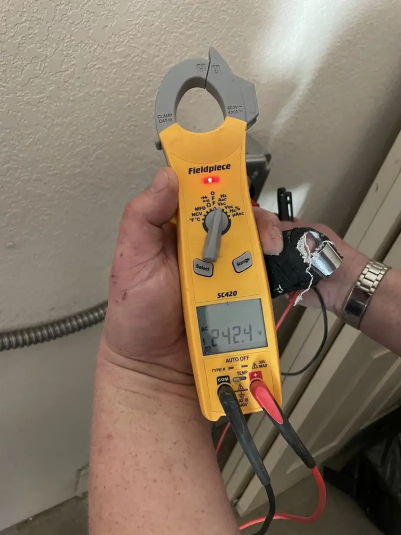 Voltage testing with clamp meter during Circuit Breaker Repair in Fond du Lac